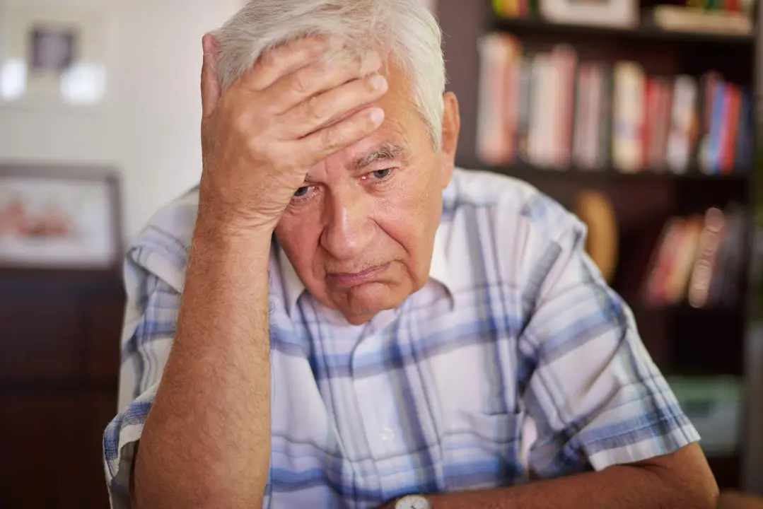 Thoughtful senior man in the living room