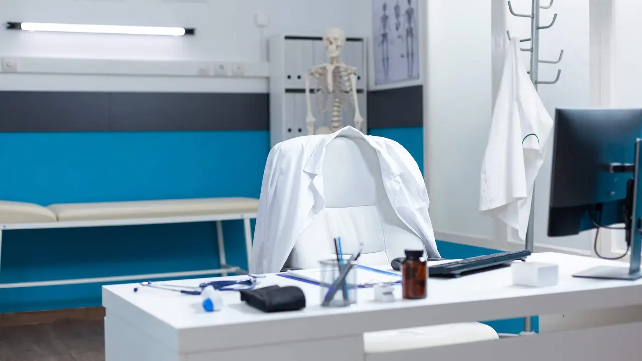 Empty modern medical office having disease documents on table equipped with contemporary furniture. Hospital workplace with nobody in it ready for sickness consultation. Medicine support