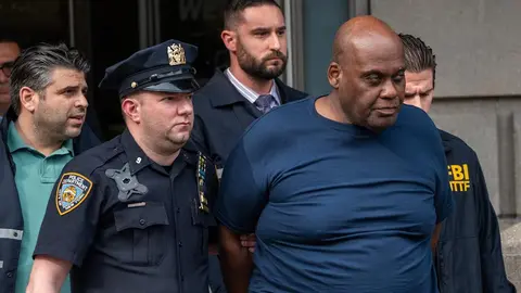 NEW YORK, NY - APRIL 13: Suspect Frank James is escorted out of the 9th Precinct by police after being arrested for his connection to the mass shooting at the 36 St subway station on April 13, 2022 in New York City. Frank James, the suspected gunman in Tuesday's shooting, was arrested this afternoon after a hotline caller's tip. James is alleged to have shot 10 people, critically injuring five, on the N train during Tuesday's morning rush hour. (Photo by David Dee Delgado/Getty Images)