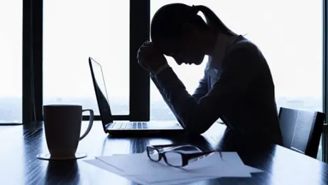 Estrés laboral. Fotografía de archivo