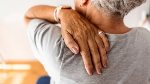 Dolor articular. Fotografía de archivo