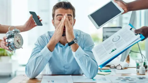 Estrés laboral. Fotografía de archivo