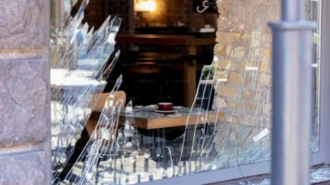 Robo negocio. Fotografía de archivo