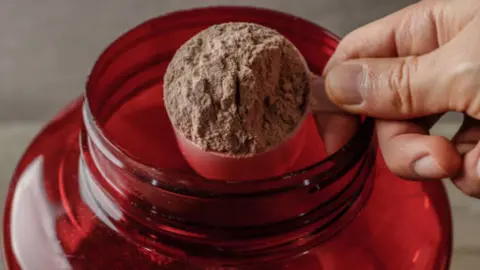 Proteína en polvo. Fotografía de archivo