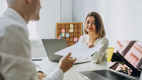 Female and male collegues working in office